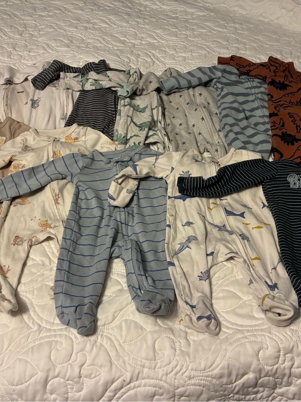 Bundle of 12 Sleepers. Newborn-0-3 months. Disney Baby, and Carter’s mainly.